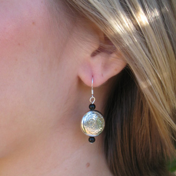 #E194 Tibetan silver earrings accented with onyx.